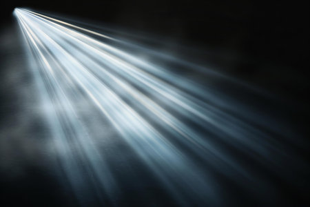 abstract scene with light rays and beams on a dark black backgroundの写真素材