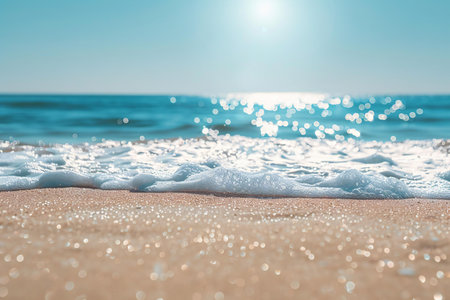 Soft wave of the sea on the sandy beach. Summer background.の写真素材