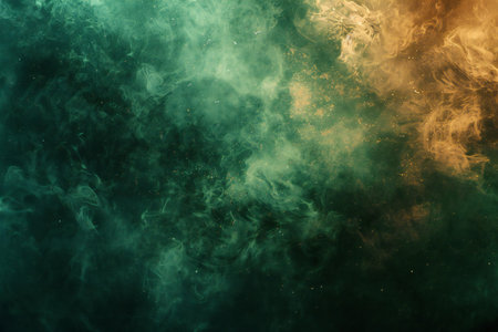 Dense multicolored smoke of green and yellow colors on a black isolated background. Background from...