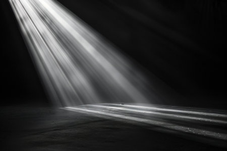 Light effect on a dark background. Rays of light from the stage.