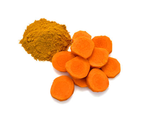 Fresh turmeric slices isolated on white background