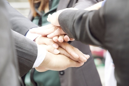 hands on hands together of business peopleの写真素材