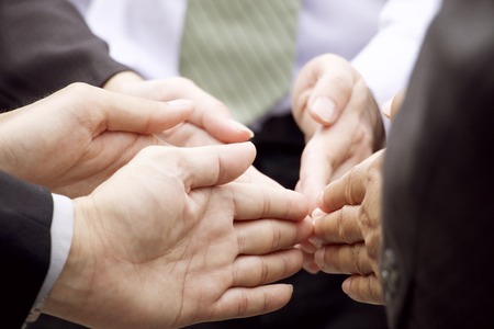 Business people are making sign of partnershipの写真素材