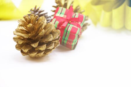 Pine cones and present on white backgroundの写真素材