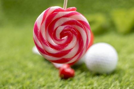 Golf ball with love shape lollipop for golfer on Valentine's dayの写真素材