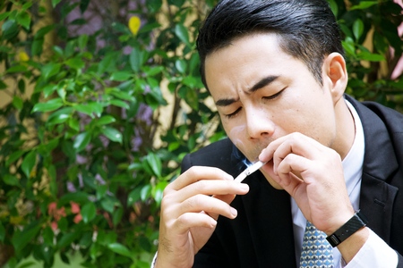 Businessman is smoking.の写真素材