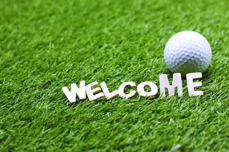 Welcome word with golf ball is on green grassの写真素材