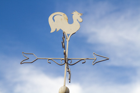 Wind cock sign on the blue skyの写真素材