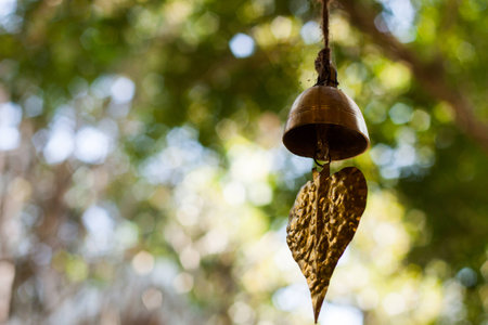 Bodhi bell against bokeh backgroundの写真素材