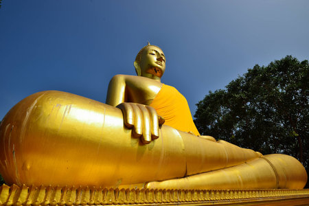 Golden big Buddha with clear sky, Chainat, Thailandの写真素材