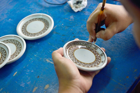 Thai people working process paint Ceramic Benjarong is traditional Thai five basic colors style potteryの写真素材