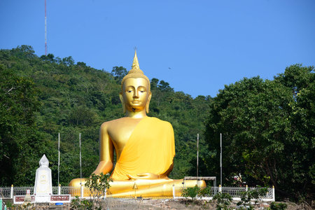 Golden big Buddha with clear sky, Chainat, Thailandの写真素材