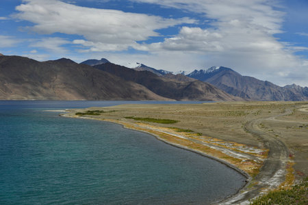 Pangong Lake in Leh, India. It is huge lake in Ladakh, altitude 4,350 m (14,270 ft) and extends from India to Tibet. Leh, Ladakh, Jammu and Kashmir, India.の写真素材