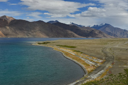 Pangong Lake in Leh, India. It is huge lake in Ladakh, altitude 4,350 m (14,270 ft) and extends from India to Tibet. Leh, Ladakh, Jammu and Kashmir, India.の写真素材