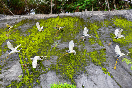 White flamingo statue on the rock in Chinese temple.の写真素材