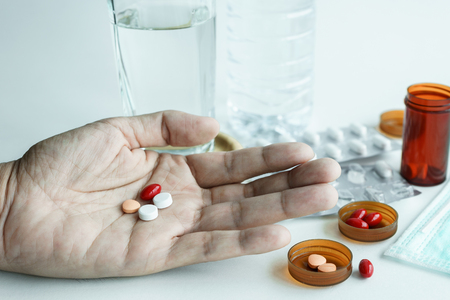 Hand holding Medicine Pills, Take Medicine Pills for Treatmentの写真素材