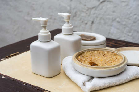 Lotion bottles and herb for spa treatment on the tableの写真素材