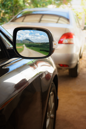 Green nature with road view in Rearview mirror, Landscape in car mirrorの写真素材