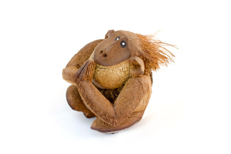 Carved monkey from coconut shell, Hand made souvenirs Thailand.の写真素材