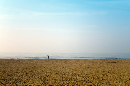 Footprints in the sand landscape beach with shadow peopleの写真素材