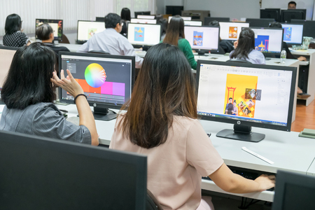 BANGKOK, THAILAND - April 28: Thammasat Computer Lab on April 28,2018 in Bangkok, Thailand. Instructor teaching Graphic Design Software Using Students at Computer room.のeditorial素材