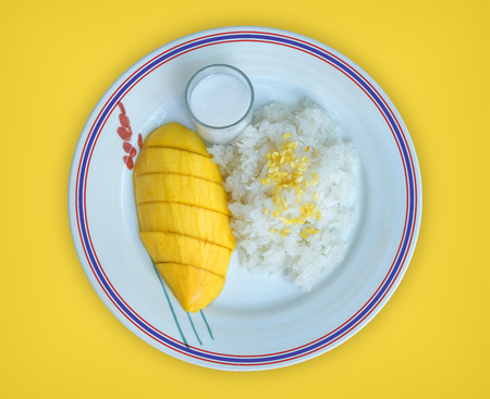 Top view of Mango sticky rice in the Thai Flag dish with coconut milk, Thai desserts are popular in summer time.の写真素材