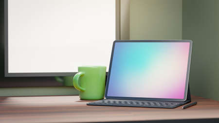 Big screen tablet with case keyboard and green coffee cup placed on wood table and wondows...