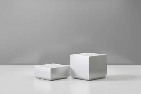 Cosmetic display product stand. Two gray blocks white background. 3D rendering illustrationの写真素材