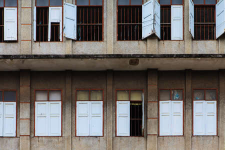 Old windows on ruin houseの写真素材