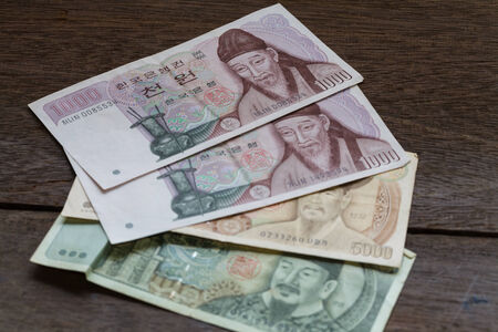 1000,5000 of Korea Won on old woodenの写真素材