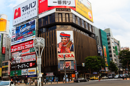 SAPPORO, JAPAN - August 13, 2013: Traffic passes through the Susukino District. Susukino is one of the three major red-light districts within Japan.のeditorial素材