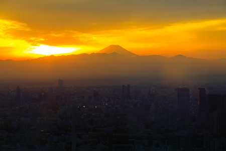 Mountain Fuji with sunset and the town in foregrundの写真素材
