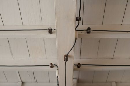Old Outdated Electrical Wiring in the ceiling of an old house. Plan scheme of the ceiling in top...