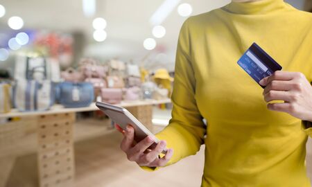 A woman with a credit card, Easy to payment shopping online new modern lifestyle by mobile phone