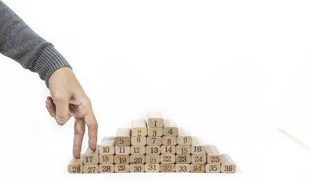 Women hand finger walk on stacked wooden block like stairs isolate on white background. Business...
