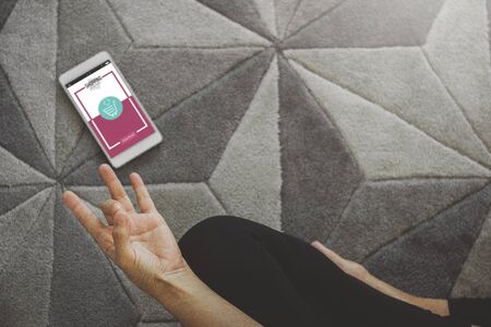 Young woman shopping online while resting after workout in home. Online shopping and modern lifestyle concept.Copy spaceの写真素材