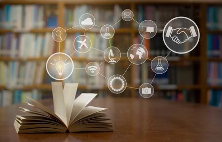 Old open book with tools for health on the table a bookshelf background for academic education learning concept.の写真素材