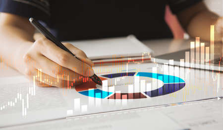 Businesswoman analyzing investment charts with laptop.Business technology online trading stock...
