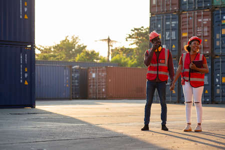 Two African american male and female worker smiling with confidence and success at workplace of...