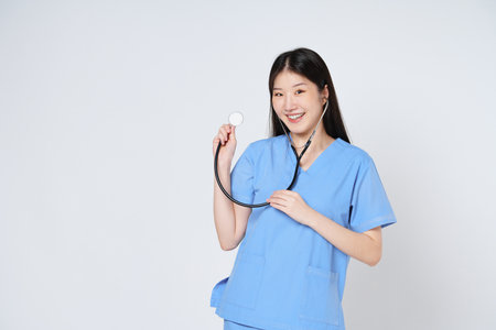 Young doctor woman wearing a stethoscope isolated on white background.の写真素材