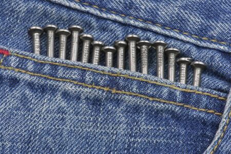 Nails in jeans pocket の写真素材