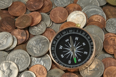 Compass on coins (in concept of financial way)の写真素材