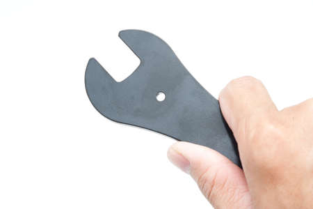 Hand holding wrench closeup
