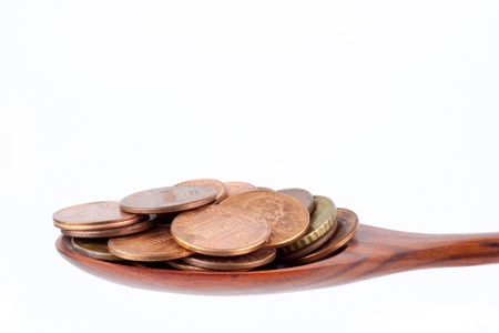 Coins in spoon for financial consuming conceptの写真素材