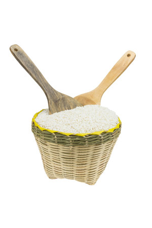 Wood spoon and bamboo basket  isolated on white backgroundの写真素材