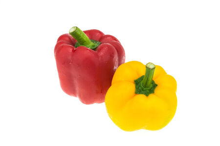 Red and yellow sweet pepper isolated on white backgroundの写真素材