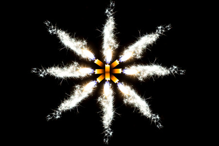 Flakes blue candle on the black background