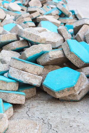 a pile of blue concrete paverの写真素材