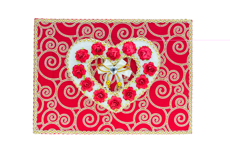 Hert rose on book isolate on white bcakgroundの写真素材