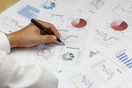 Businessman Summary report and financial analyzing capital market plan, and Review accounting data and calculate order income.の写真素材